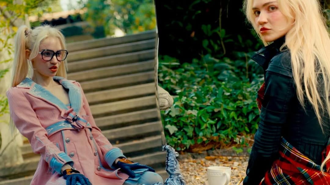 Anime army girls, cave people, fake weapons, and more in Grimes' "Artificial Angels" music video